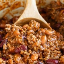 A labeled image of The Pioneer Woman's Chili recipe being scooped up from a pot.