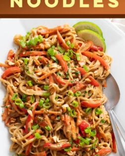 A labeled image of Peanut Butter Noodles on a white tray with lime slices.